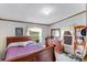 Comfortable bedroom featuring a wooden bed frame, dresser, and ample natural light at 6310 W County Road 4, Berthoud, CO 80513