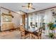 Bright dining room featuring light wood furniture, large windows, and pastoral views at 6310 W County Road 4, Berthoud, CO 80513