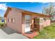 Charming exterior featuring a small front porch, gravel surroundings, and a traditional air conditioning unit at 6310 W County Road 4, Berthoud, CO 80513