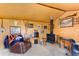 Interior features a wood stove, rustic decor, and leather recliner at 6310 W County Road 4, Berthoud, CO 80513