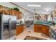 Functional kitchen featuring stainless steel appliances, wooden cabinetry, and an open layout at 6310 W County Road 4, Berthoud, CO 80513