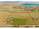 Expansive land outlined in red, showing property lines of land with rolling hills and a distant lake at 6310 W County Road 4, Berthoud, CO 80513