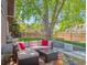 Relaxing backyard patio with comfortable seating and a large shade tree at 7379 S Lafayette W Cir, Centennial, CO 80122