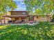 Wide shot of backyard with a covered patio and relaxing backyard patio at 7379 S Lafayette W Cir, Centennial, CO 80122