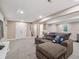 Basement living room area with stairs leading up to the main floors at 7379 S Lafayette W Cir, Centennial, CO 80122