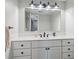 Stylish bathroom with modern vanity, sleek lighting, and a large mirror at 7379 S Lafayette W Cir, Centennial, CO 80122