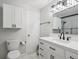 Renovated bathroom with white vanity, subway tiles, and modern fixtures at 7379 S Lafayette W Cir, Centennial, CO 80122