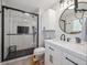 Modern bathroom features a sleek glass-enclosed shower, stylish vanity, and updated fixtures at 7379 S Lafayette W Cir, Centennial, CO 80122