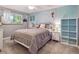 Comfortable bedroom with neutral tones, carpet, and a view of the backyard at 7379 S Lafayette W Cir, Centennial, CO 80122