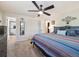 Spacious bedroom features a comfortable bed, closet, and an attached bath at 7379 S Lafayette W Cir, Centennial, CO 80122