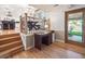 Entryway with hardwood floors, and access to kitchen, dining and outdoor patio at 7379 S Lafayette W Cir, Centennial, CO 80122