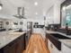 Modern kitchen features granite counters, stainless appliances, black hardware, and wood floors at 7379 S Lafayette W Cir, Centennial, CO 80122