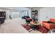 Open basement area featuring a comfortable seating arrangement and recreational equipment at 3630 Gold Bug St, Aurora, CO 80019
