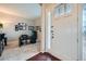 Bright entryway features decorative glass door panels, hardwood floors, and adjacent home office at 3630 Gold Bug St, Aurora, CO 80019