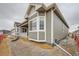 Charming single-Gathering home with large bay windows, neutral gray siding, and white trim at 3630 Gold Bug St, Aurora, CO 80019