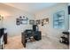 Functional home office is carpeted, featuring a window, and space for work and hobbies at 3630 Gold Bug St, Aurora, CO 80019