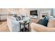 Spacious living room features a fireplace, plush seating, and abundant natural light at 3630 Gold Bug St, Aurora, CO 80019