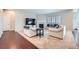 Cozy living room features a fireplace, plush seating, and abundant natural light at 3630 Gold Bug St, Aurora, CO 80019
