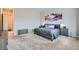 Spacious main bedroom with plush carpeting, neutral tones, and a decorative art piece at 3630 Gold Bug St, Aurora, CO 80019