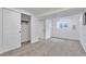 Finished basement bedroom featuring bright paint, closet, and light-filled egress window at 3575 S Ouray St, Aurora, CO 80013