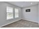Neutral bedroom with two large windows providing ample natural light and tan carpet at 3575 S Ouray St, Aurora, CO 80013