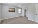 Neutral bedroom with window providing ample natural light and beige carpet at 3575 S Ouray St, Aurora, CO 80013