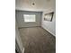 Neutral bedroom with carpeted floors, and a large window with blinds at 3575 S Ouray St, Aurora, CO 80013