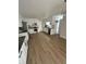 Modern kitchen with white cabinets, stainless steel appliances, and luxury vinyl plank flooring at 3575 S Ouray St, Aurora, CO 80013