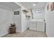 Functional laundry room features ample natural light, open shelving, and modern washer and dryer at 3575 S Ouray St, Aurora, CO 80013
