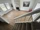 Bright living room with a fireplace and lots of natural light from several windows at 3575 S Ouray St, Aurora, CO 80013
