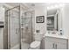 Updated bathroom with a tiled shower, modern fixtures, and a sleek vanity at 2437 E Geddes Pl, Centennial, CO 80122