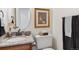 Stylish half bathroom features elegant granite countertop, modern fixtures, and chic decor at 2437 E Geddes Pl, Centennial, CO 80122