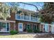 Charming brick two-story townhome with a delightful upstairs balcony and beautiful landscaping at 2437 E Geddes Pl, Centennial, CO 80122