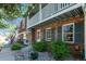Charming brick townhome with delightful upstairs balcony and lovely rock and shrub landscaping at 2437 E Geddes Pl, Centennial, CO 80122