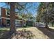 Exterior view of townhomes with upstairs balconies, beautiful lawns, and mature trees at 2437 E Geddes Pl, Centennial, CO 80122