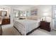 Inviting bedroom with mirrored closet doors, and a private ensuite bathroom at 2437 E Geddes Pl, Centennial, CO 80122