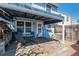Inviting covered patio with table, chairs, and view of the backyard at 2437 E Geddes Pl, Centennial, CO 80122