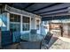 Cozy covered patio with a seating area perfect for entertaining at 2437 E Geddes Pl, Centennial, CO 80122