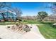 Well-manicured yard with lush green grass and mature trees at 2437 E Geddes Pl, Centennial, CO 80122