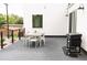 Outdoor patio featuring a grill and dining area, with a neutral color palette at 5462 S Cedar St, Littleton, CO 80120
