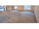 Unfinished basement with concrete floors, exposed studs, and natural light at 5462 S Cedar St, Littleton, CO 80120