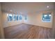 Spacious bedroom with hardwood floors and multiple windows at 5462 S Cedar St, Littleton, CO 80120
