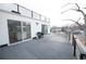 Expansive deck features a modern railing and sliding glass doors to indoor spaces and gas grill at 5462 S Cedar St, Littleton, CO 80120