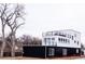 Contemporary two-story home boasting sleek black and white exterior, and multiple balconies for outdoor enjoyment at 5462 S Cedar St, Littleton, CO 80120