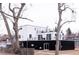 A modern home with black and white exterior, multiple balconies providing outdoor space and neighborhood views at 5462 S Cedar St, Littleton, CO 80120