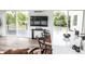 Open-concept kitchen boasts an oversized island, counter seating, and sliding doors to a terrace at 5462 S Cedar St, Littleton, CO 80120