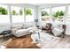 Bright living room featuring large windows, modern furniture, and stylish decor at 5462 S Cedar St, Littleton, CO 80120
