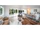 Spacious living area seamlessly connects to the modern kitchen and offers access to outdoor spaces at 5462 S Cedar St, Littleton, CO 80120