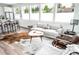 Bright living room featuring large windows, modern furniture, and stylish decor at 5462 S Cedar St, Littleton, CO 80120