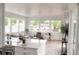 Open concept living space with large windows, modern furniture, and bright natural light at 5462 S Cedar St, Littleton, CO 80120